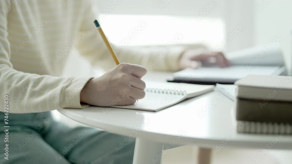 young asian student woman doing lesson exam at college dormitory. young asian student woman doing lesson exam at college dormitory.