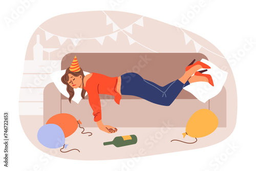 Drunk woman spins on sofa after birthday party, among scattered balloons and bottles. Consequences of party for girl who drank lot of alcohol and felt hangover, for concept of female drunkenness