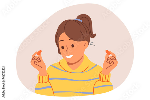 Woman uses earplugs to block out noise from neighbors so can concentrate or sleep. Earplugs in hands of happy teenage girl preparing ready to start work and getting rid of distractions