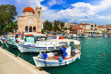 Saronics islands of Greece .Authentic beautiful Greek island -Aegina with traditional fishing boats and St. Nicholas Church.