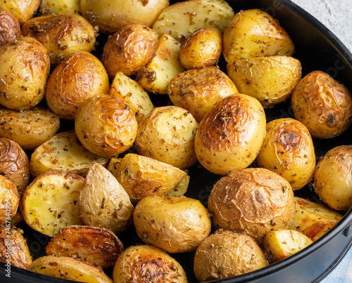 Roasted baked baby potatoes with garlic and herbs.