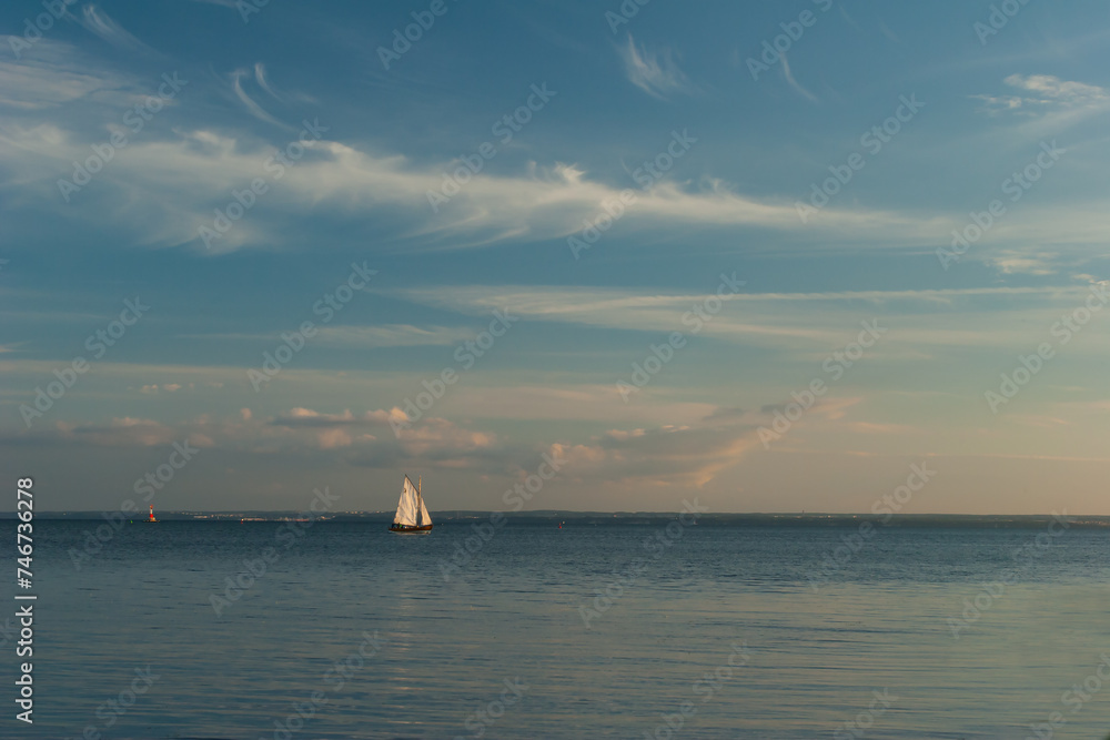 A sailboat on the lake on a sunny day