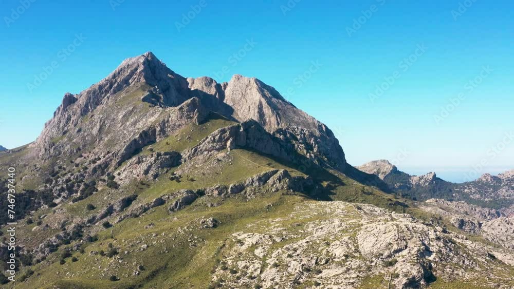 Amazing drone view of the Mallorcan landscape. Scenic aerial view. Majestic mountains covered with clouds, sunny day. Mallorca, Majorca, Spain, Balearic Islands 