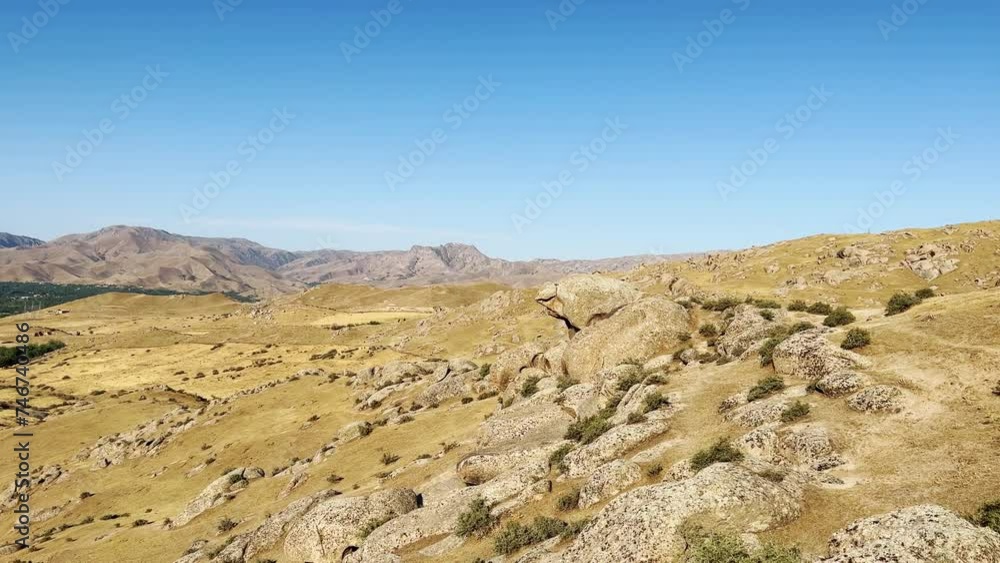 The Valley of Demons in Uzbekistan in the Samarkand region. Boulders, granite sculptures, huge boulders of bizarre shapes in the spurs of the Zaravshansky ridge. 4K Video The Valley of Demons in Uzbekistan in the Samarkand region. Boulders, granite sculptures, huge boulders of bizarre shapes in the spurs of the Zaravshansky ridge. 4K Video
