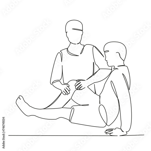 Osteopath examines a teenager's knee