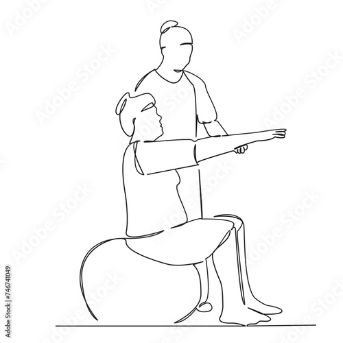 Osteopath giving physical therapy to woman on ball