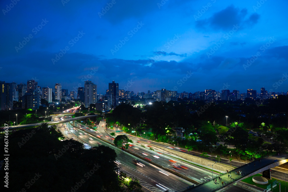 Aerial night view of Av. 23 de Maio, in Sao Paulo, Brazil, with Ibirapuera Park on the right