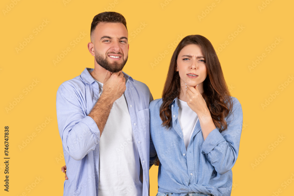 Confident man grinning, woman with sore throat Confident man grinning, woman with sore throat