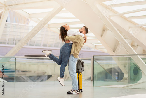 Long-Awaited Reunion. Romantic Young Couple Embracing At Airport After Arrival