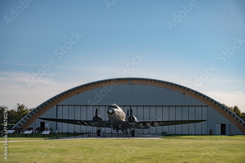 Detail of the large American twin-engine  C-47 Dakota Skytrain aircraft from the Second World War in front of the hangar at Museum and the Merville Battery site © Adolf