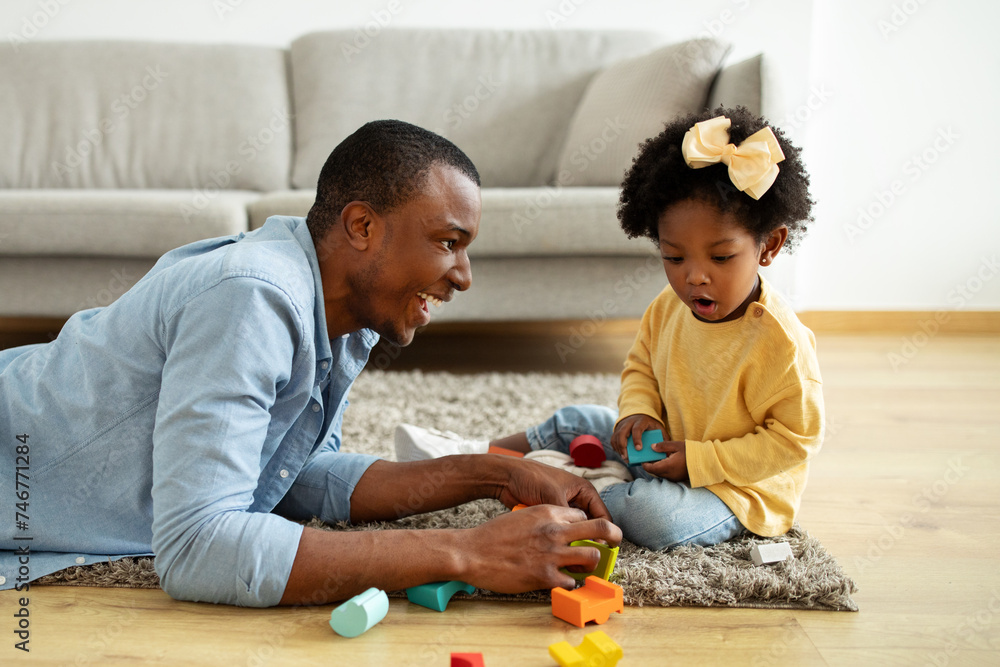 Beautiful little black girl enjoying time with her daddy Beautiful little black girl enjoying time with her daddy