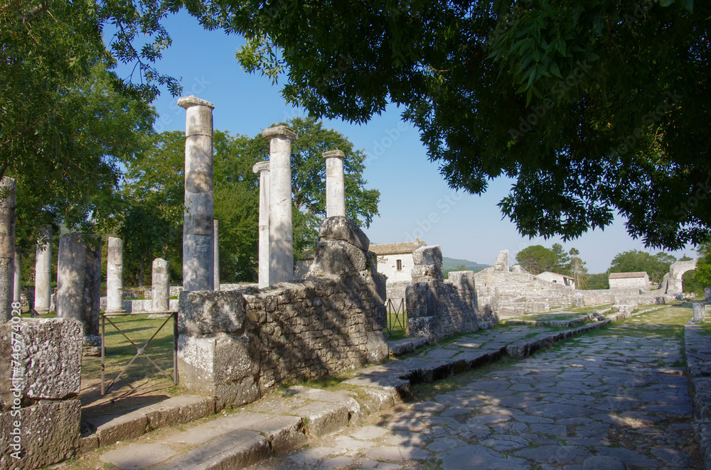Archaeological site of Altilia: The pavement of a Roman road and remains of columns indicating where the Basilica once stood. Sepino, Molise, Italy