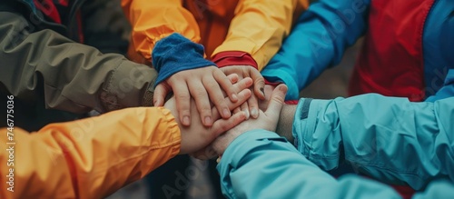 Top view group of volunteers cooperate to the job with joining hands together. AI generated image photo