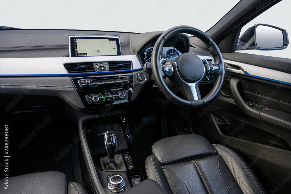 Interior of a modern luxury car with an automatic gear box and climate controls