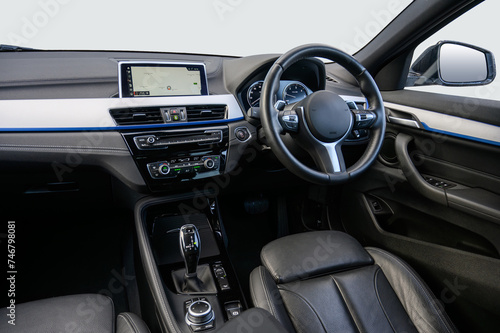 Interior of a modern luxury car with an automatic gear box and climate controls