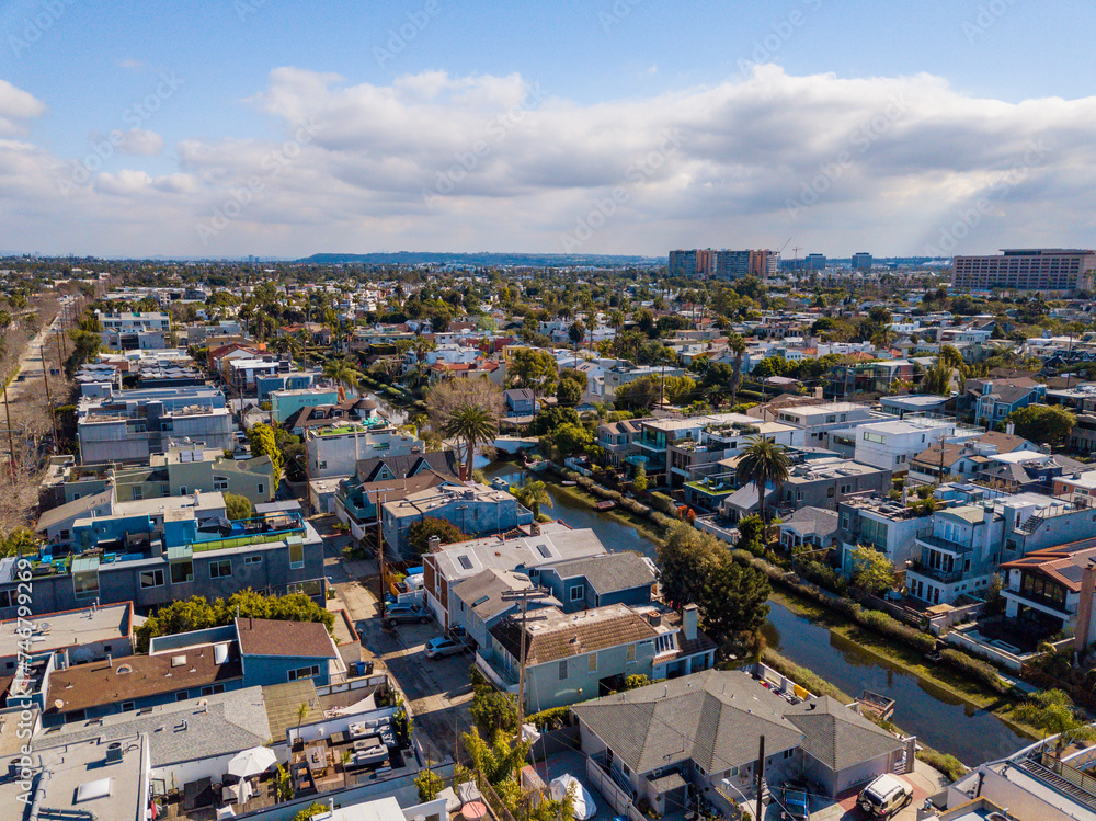 Aerial drone view over Venice Canals Historic District looking Southeast towards Culver City on an overcast day.