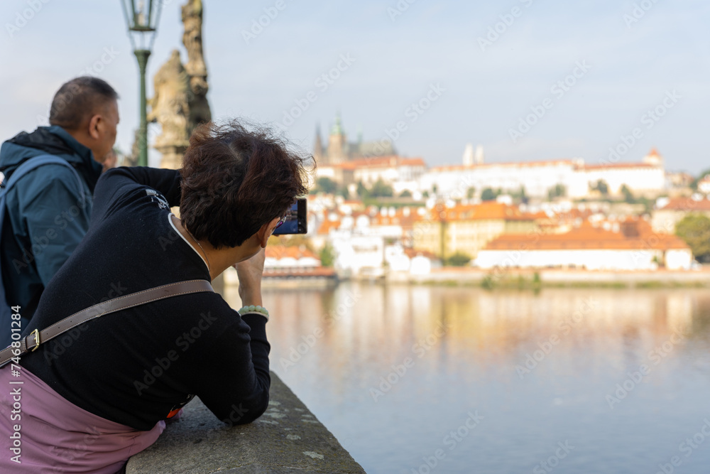 Woman taking a picture on a bridge traveling museum