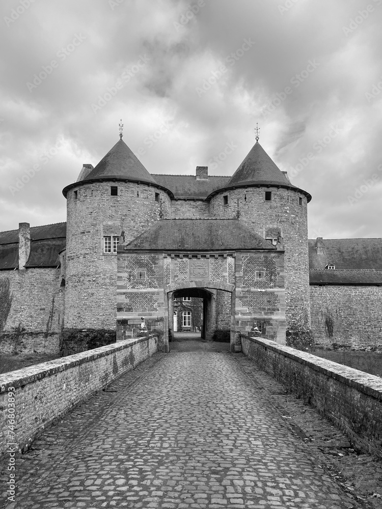 The Castle of Corroy-le-Chateau (French: Château de Corroy-le-Château) is a medieval castle in the village of Corroy-le-Château, in the province of Namur, Wallonia, Belgium. Black and white photo The Castle of Corroy-le-Chateau (French: Château de Corroy-le-Château) is a medieval castle in the village of Corroy-le-Château, in the province of Namur, Wallonia, Belgium. Black and white photo