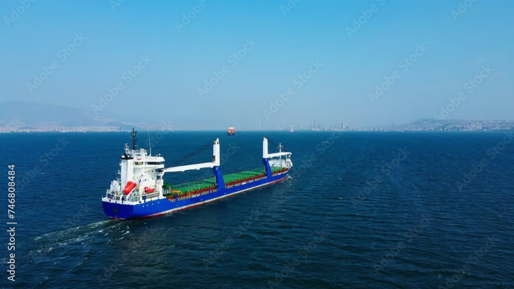 Bulk cargo carrier ship for carrying dry grain cargo at sea, aerial wide shot Bulk cargo carrier ship for carrying dry grain cargo at sea, aerial wide shot