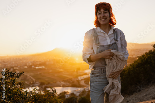 Woman waving handkerchief in wind, in nature at sunset!!!