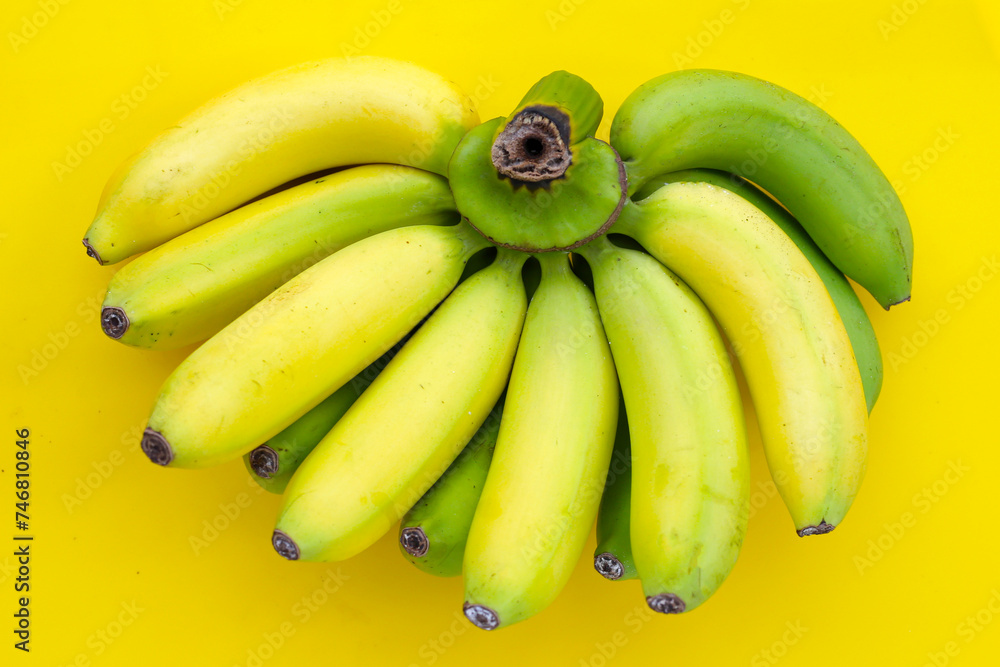 Banana on a yellow background.