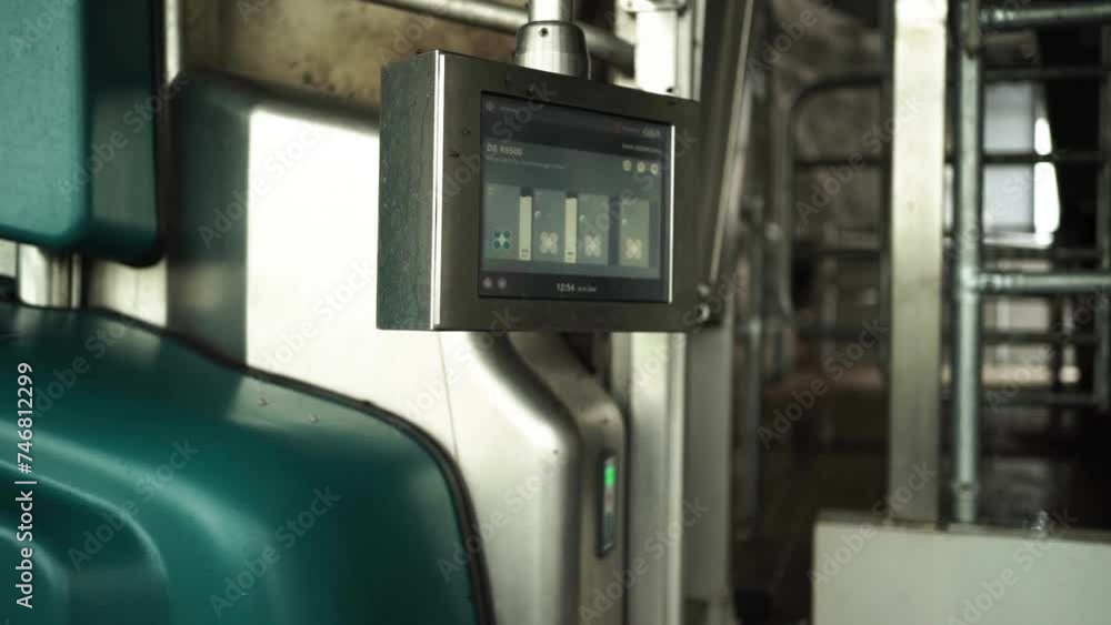 Cow milking system. Atomatiс dairy robot for milking cows at dairy farm Cow milking system. Atomatiс dairy robot for milking cows at dairy farm