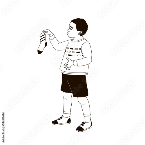 African American boy holding a sock in his hands