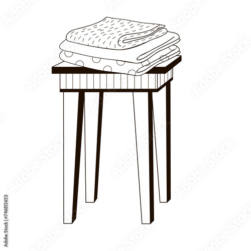 stack of clean towels on a stool