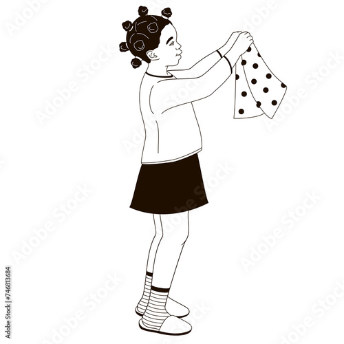  African American girl holding clean clothes in her hands