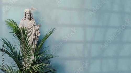 Jesus statue decorated with palm leaf for Palm sunday presentation background with blue animated backdrop Happy easter