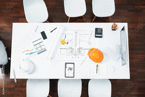 Top view empty workspace table for civil engineer and architectural construction development with paperwork and equipment for civil engineering background. Prudent photo