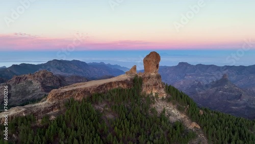 Aerial shot picturesque paradise of Roque Nublo, Flight over of a volcanic rock in caldera of Tejeda, Gran Canaria, Canary islands, Spain. photo