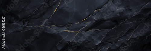 Wide panoramic surface of black marble abstract stone texture with gold veins dark-gray tone. For banner, background design