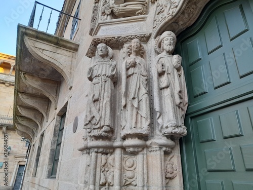 Detalle de las esculturas en la puerta de acceso al colegio de San Xerome en Santiago de Compostela, Galicia photo