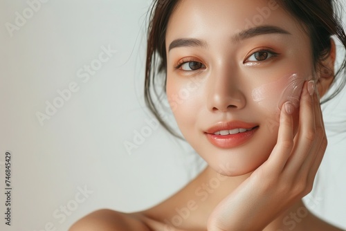 High quality photo of skincare and cosmetics concept with room for text Woman with beautiful face touching healthy facial skin portrait Happy Asian girl with n