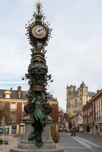 Streetscape in Amiens, France with clock and cathedral