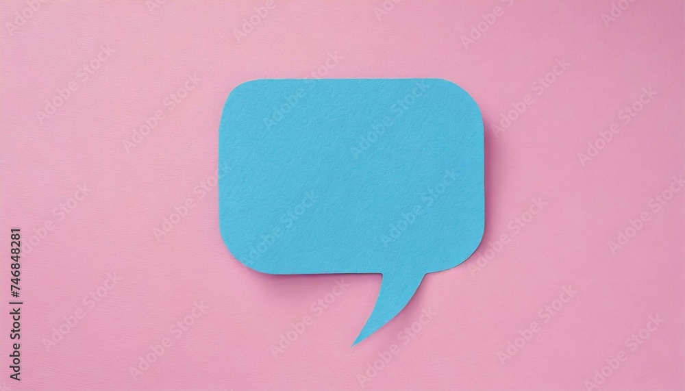 Blue paper cut out speech bubble shape set on pink paper background. Blue paper cut out speech bubble shape set on pink paper background.