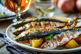 Sardines potatoes and a glass of wine served fried