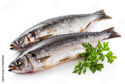 Two complete sardines on a white surface