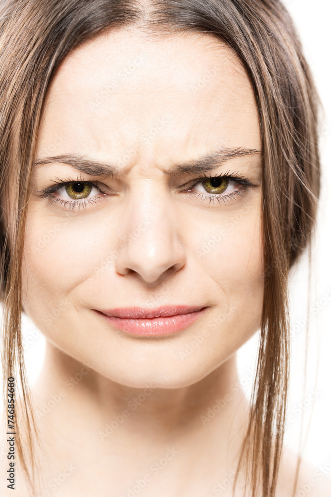A close-up shot of a woman contorting her face into a confused expression. A close-up shot of a woman contorting her face into a confused expression.