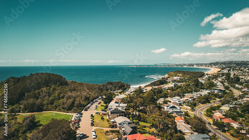 Stunning ocean view of the waves and beach in the Northern Beaches of NSW, Sydney, Australia. The view was captured from above using a drone.