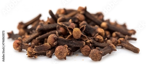 Fragrant Cloves Heap on Clean White Background - Aromatic Spice Collection