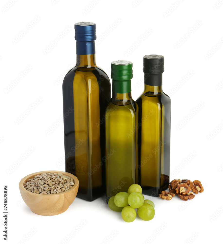 Vegetable fats. Bottles of different cooking oils and ingredients isolated on white Vegetable fats. Bottles of different cooking oils and ingredients isolated on white