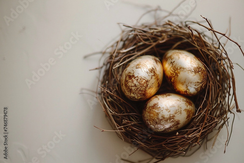 three golden eggs in a bird's nest