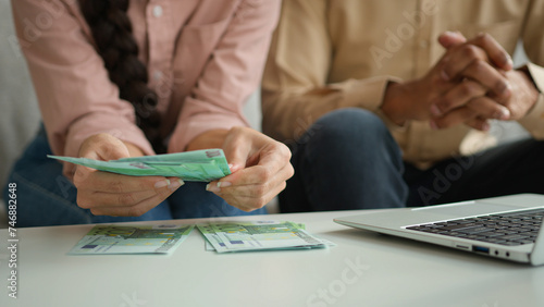 Fotografie Unrecognizable woman man counting euro distribute money cash salary finances pla