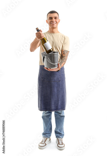 Young male bartender with b...