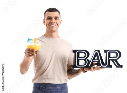 Young male bartender with g...