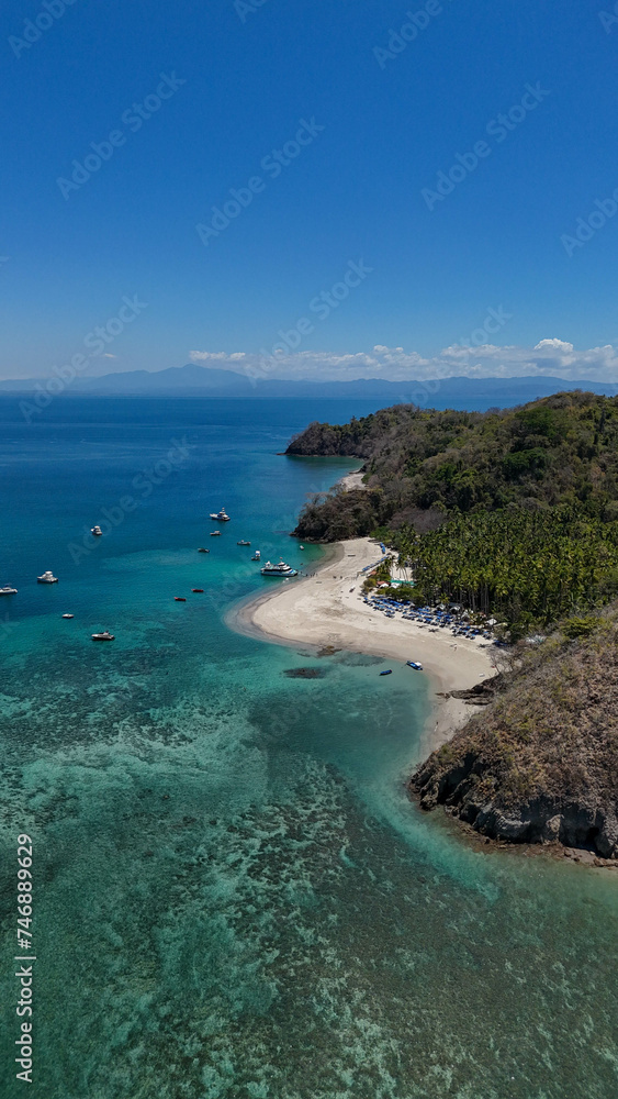 Drone aerial view of Isla Tortuga, tropical paradise beach island in Costa Rica central america Nicoya peninsula