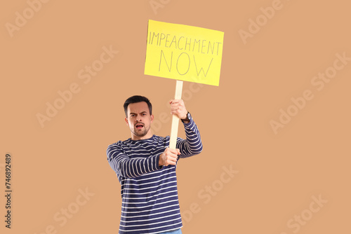 Protesting young man holdin...
