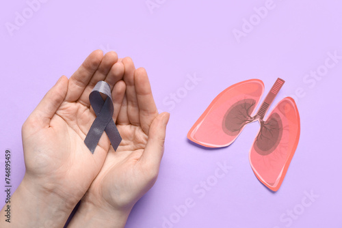 Female hands with grey ribb...